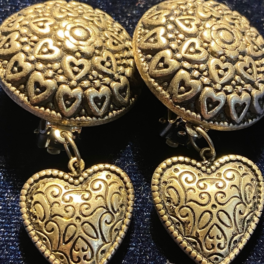 Clip on silver colored dangling heart earrings